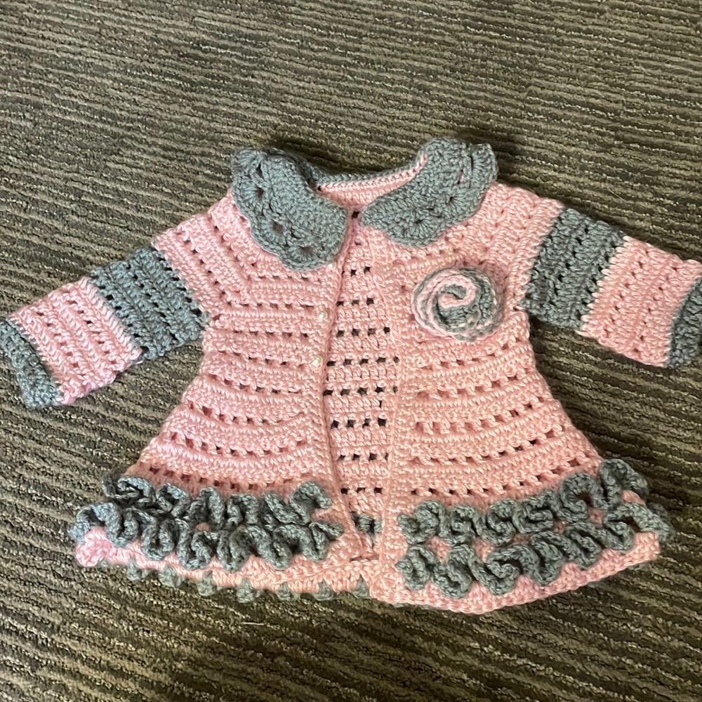 Gorgeous hand knit coat with front pearl buttons.  NWOT